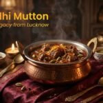 Awadhi mutton curry slow cooked in dum pukht style served in a traditional copper handi